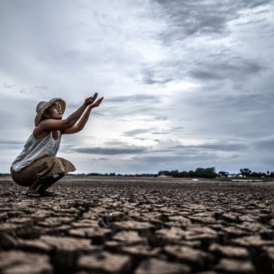 woman-is-sitting-asking-rain-dry-season-global-warming